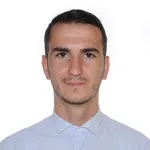 E. Kurti